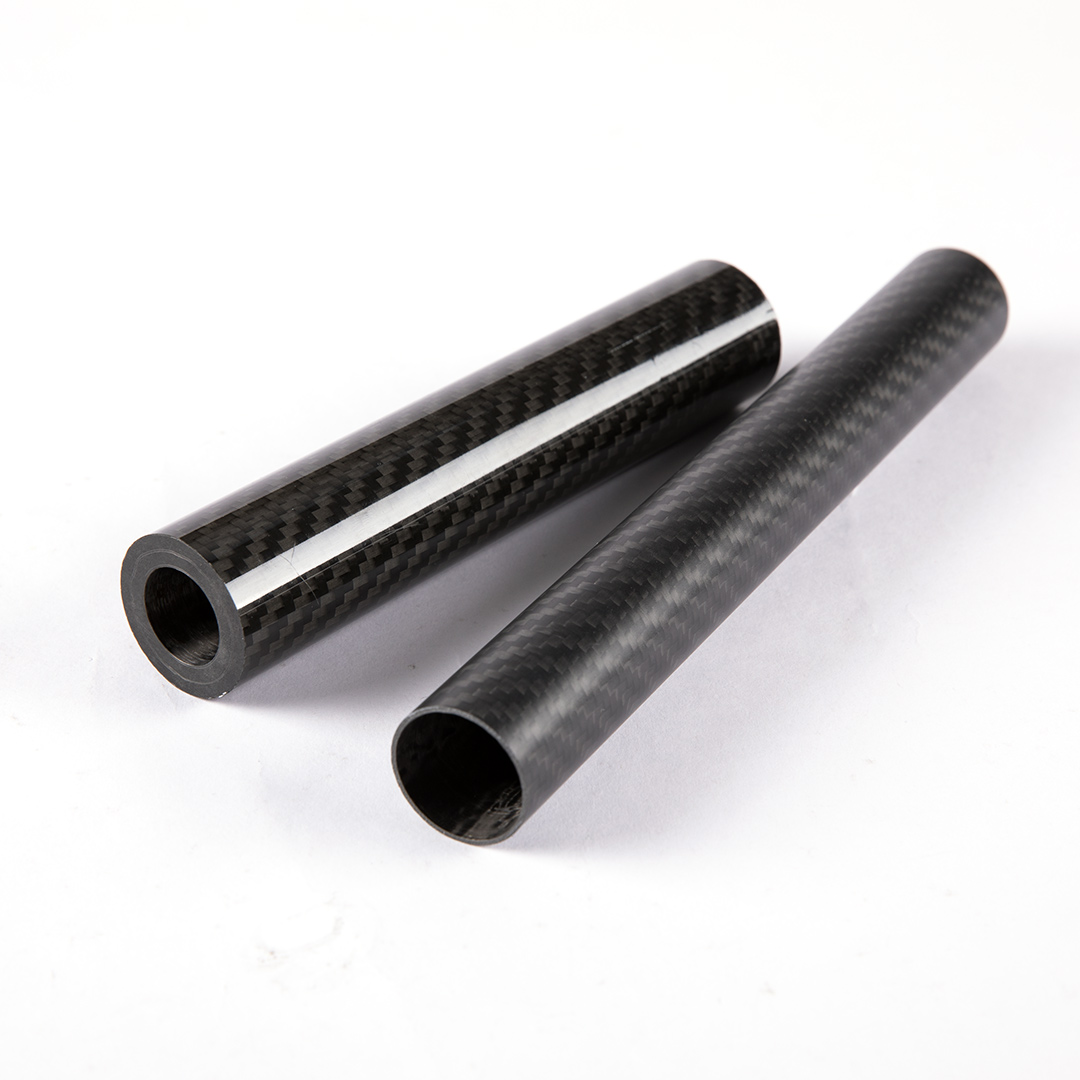 Black carbon weave round tube close up